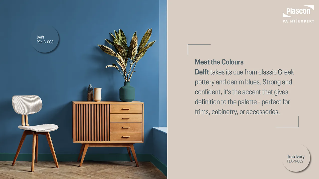 Home office feature wall painted in Paint Club's Delft, with warm wooden furnishings.