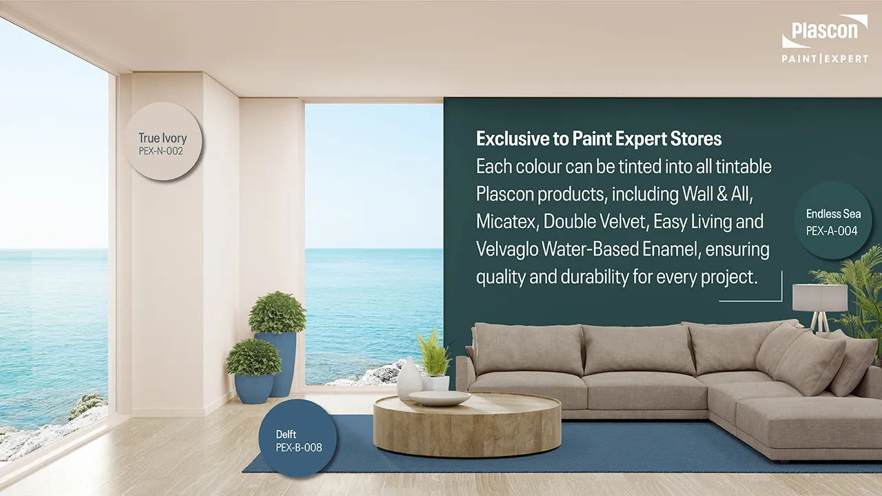 Living room with Endless Sea feature wall and True Ivory décor accents, styled with soft neutrals and natural textures for a coastal South African home.